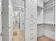 Organized walk-in closet with custom shelving and drawers providing ample storage space at 2425 Peachtree Ne Rd # 902, Atlanta, GA 30305