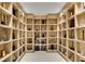 Custom wine cellar with built-in wooden shelves, offering ample storage for wine bottles and sophisticated decor at 2425 Peachtree Ne Rd # 902, Atlanta, GA 30305