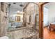 Modern bathroom featuring a glass-enclosed shower with stone flooring and double shower heads at 5097 Peachtree Rd # I, Atlanta, GA 30341