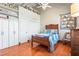 Bedroom featuring hardwood floors, closets and wooden bed at 5097 Peachtree Rd # I, Atlanta, GA 30341
