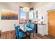 Bright dining area with dark wooden table, blue velvet chairs, and natural light at 5097 Peachtree Rd # I, Atlanta, GA 30341