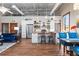 Open kitchen features stainless steel appliances, white cabinetry, and a butcher block island with seating at 5097 Peachtree Rd # I, Atlanta, GA 30341