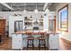 Bright kitchen island features a butcher block countertop, seating, and modern appliances at 5097 Peachtree Rd # I, Atlanta, GA 30341