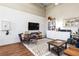 Well lit living room featuring exposed brick, decor, and furniture at 5097 Peachtree Rd # I, Atlanta, GA 30341