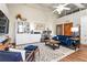 Comfortable living room area features a blue sofa, desk, and integrated living spaces at 5097 Peachtree Rd # I, Atlanta, GA 30341