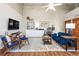 Comfortable living room area with a blue sofa, patterned rug, and ample space for relaxation and entertainment at 5097 Peachtree Rd # I, Atlanta, GA 30341