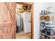 Pantry room with washer and dryer and storage racks at 5097 Peachtree Rd # I, Atlanta, GA 30341