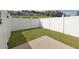 Private backyard features a patio and lawn area, enclosed by a white picket fence at 577 Cypher Drive, Suwanee, GA 30024