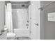 This bathroom features a tub and shower combination behind a white curtain in a convenient layout at 577 Cypher Drive, Suwanee, GA 30024