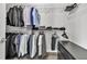 Walk-in closet featuring racks of hanging clothes and shelving for storing folded items at 577 Cypher Drive, Suwanee, GA 30024
