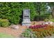 Stonecypher community entrance sign surrounded by colorful landscaping and lush greenery at 577 Cypher Drive, Suwanee, GA 30024