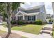 Charming home on a corner lot features lush lawn, sidewalk and appealing curb appeal at 577 Cypher Drive, Suwanee, GA 30024