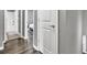 Bright hallway providing entry to bedrooms and bathrooms, featuring modern hardwood floors at 577 Cypher Drive, Suwanee, GA 30024
