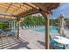 Enjoy the community pool with ample seating under a pergola, perfect for relaxation and socializing at 577 Cypher Drive, Suwanee, GA 30024