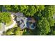 Aerial view of the home's roof and backyard oasis with pool, surrounded by lush greenery and mature landscaping at 63 Lewellen Dr, Marietta, GA 30064