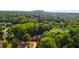 An aerial view shows the home at 63 Lewellen nestled among lush trees and mature landscaping at 63 Lewellen Dr, Marietta, GA 30064