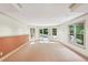 Finished basement featuring neutral paint, carpet and a door leading to the pool and backyard at 63 Lewellen Dr, Marietta, GA 30064