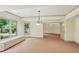 Finished basement area with carpet, a window seat and large window looking out to greenery at 63 Lewellen Dr, Marietta, GA 30064