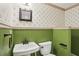 Powder room with a decorative wallpaper, beadboard, and pedestal sink at 63 Lewellen Dr, Marietta, GA 30064