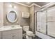 Bathroom with white vanity, round mirror, and a shower/tub combination at 63 Lewellen Dr, Marietta, GA 30064