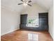 Bedroom with vaulted ceilings, hardwood floors, built-in bookcases and window seat at 63 Lewellen Dr, Marietta, GA 30064