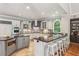 Bright kitchen features updated appliances, granite countertops and a breakfast bar with seating at 63 Lewellen Dr, Marietta, GA 30064