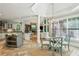 Open kitchen area with modern appliances, island, breakfast nook, and view to the living room at 63 Lewellen Dr, Marietta, GA 30064