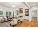Bright living room with hardwood floors, fireplace, built-in shelves, and large windows, great for gathering and relaxation at 63 Lewellen Dr, Marietta, GA 30064