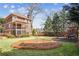 Landscaped backyard featuring lawn, mature trees, and play area at 1211 Thornwell Dr, Brookhaven, GA 30319