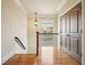 Bright hallway with hardwood floors, a window, and classic wooden trim at 1211 Thornwell Dr, Brookhaven, GA 30319