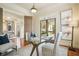 Bright office with a glass table, French doors and views of the outdoor space at 1211 Thornwell Dr, Brookhaven, GA 30319