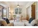 Bright office with a glass table, French doors and views of the outdoor space at 1211 Thornwell Dr, Brookhaven, GA 30319
