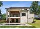 Stunning modern home exterior featuring a covered deck, backyard pool, and a private outdoor oasis at 3293 Lenox Ne Pl, Atlanta, GA 30324