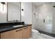 Bathroom featuring a sleek vanity, walk-in shower with glass door, and elegant fixtures creating a modern spa-like experience at 3293 Lenox Ne Pl, Atlanta, GA 30324