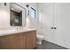 Contemporary bathroom with wood vanity, quartz countertop, and modern black fixtures at 3293 Lenox Ne Pl, Atlanta, GA 30324