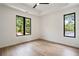 Bright bedroom with hardwood floors and great natural light from the black frame windows at 3293 Lenox Ne Pl, Atlanta, GA 30324