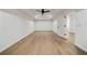 Spacious bonus room featuring hardwood floors, tray ceiling, ceiling fan and ample natural light from doorways at 3293 Lenox Ne Pl, Atlanta, GA 30324