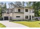 Beautiful new home with a large driveway, attached garage, and manicured landscaping at 3293 Lenox Ne Pl, Atlanta, GA 30324