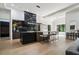 Spacious kitchen featuring a black marble backsplash, island seating, and an open layout at 3293 Lenox Ne Pl, Atlanta, GA 30324