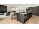 Sleek, modern kitchen with a large island, breakfast bar, and designer finishes at 3293 Lenox Ne Pl, Atlanta, GA 30324