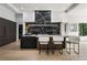 Stylish kitchen featuring a black marble backsplash, island seating, and contemporary design at 3293 Lenox Ne Pl, Atlanta, GA 30324