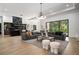 Spacious living room featuring stylish furniture, hardwood floors, and large windows at 3293 Lenox Ne Pl, Atlanta, GA 30324