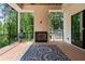 Covered patio featuring a wood ceiling, fireplace, and view of backyard at 3293 Lenox Ne Pl, Atlanta, GA 30324