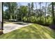 Backyard with a modern dark-bottom pool, spa, and lush greenery at 3293 Lenox Ne Pl, Atlanta, GA 30324