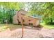 Side view of house, showing backyard with trees and lawn at 3851 Natalie Way, Ellenwood, GA 30294