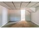 Spacious basement featuring neutral carpet, white walls, and an open doorway at 3851 Natalie Way, Ellenwood, GA 30294