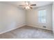 Well-lit bedroom featuring a ceiling fan, and a window offering natural light at 3851 Natalie Way, Ellenwood, GA 30294