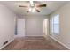 Bedroom with ceiling fan, neutral carpeting, a window and doorways to the rest of the home at 3851 Natalie Way, Ellenwood, GA 30294