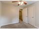 Bedroom with neutral carpet, standard closet, and doorway to other parts of the home at 3851 Natalie Way, Ellenwood, GA 30294