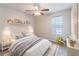 Bright bedroom with a comfortable bed, soft lighting, and decorations at 3851 Natalie Way, Ellenwood, GA 30294